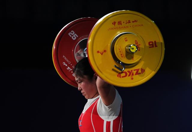 (250511) -- JIANGSHAN, May 11, 2025 (Xinhua) -- Kim Il Gyong of the Democratic People's Republic of Korea (DPRK) competes during the women's 59kg competition at 2025 Asian Weightlifting Championships in Jiangshan, east China's Zhejiang Province, May 11, 2025. (Xinhua/Hou Zhaokang)