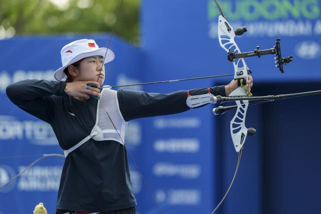 (250511) -- SHANGHAI, May 11, 2025 (Xinhua) -- Zhu Jingyi of China competes during the gold final of the Recurve Women's Team competition at Shanghai 2025 Archery World Cup Stage 2 in Shanghai, east China, May 11, 2025. (Xinhua/Wang Xiang)