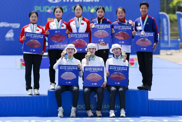 (250511) -- SHANGHAI, May 11, 2025 (Xinhua) -- Gold medalist team South Korea (bottom), silver medalists team China (top L) and bronze medalists team Chinese Taipei pose during the awarding ceremony for the Recurve Women's Team competition at Shanghai 2025 Archery World Cup Stage 2 in Shanghai, east China, May 11, 2025. (Xinhua/Wang Xiang)