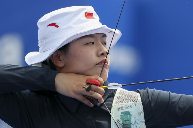 (250511) -- SHANGHAI, May 11, 2025 (Xinhua) -- Huang Yuwei of China competes during the gold final of the Recurve Women's Team competition at Shanghai 2025 Archery World Cup Stage 2 in Shanghai, east China, May 11, 2025. (Xinhua/Wang Xiang)