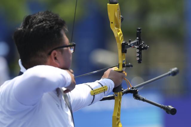 (250511) -- SHANGHAI, May 11, 2025 (Xinhua) -- Kim Woojin of South Korea competes during the gold final of the Recurve Mixed Team competition at Shanghai 2025 Archery World Cup Stage 2 in Shanghai, east China, May 11, 2025. (Xinhua/Wang Xiang)
