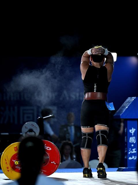 (250511) -- JIANGSHAN, May 11, 2025 (Xinhua) -- Elreen Ann Ando of the Philippines reacts during the women's 64kg competition at 2025 Asian Weightlifting Championships in Jiangshan, east China's Zhejiang Province, May 11, 2025. (Xinhua/Hou Zhaokang)