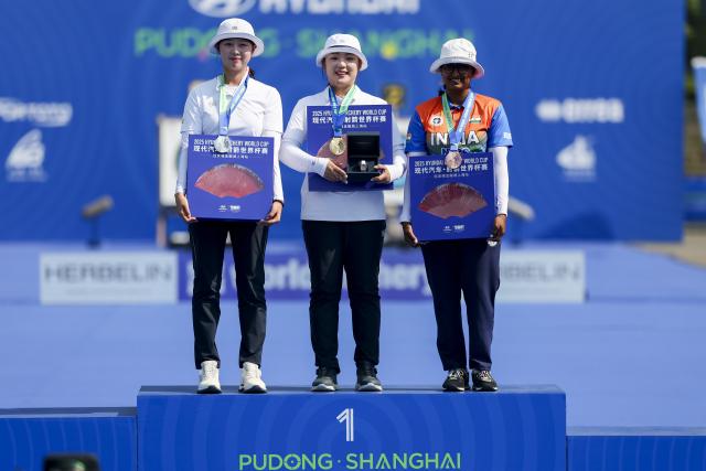 (250511) -- SHANGHAI, May 11, 2025 (Xinhua) -- Gold medalist Lee Gahyun (C) of South Korea, silver medalist Lim Sihyeon (L) of South Korea and bronze medalist Deepika Kumari of India pose during the awarding ceremony of the Recurve Women's competition at Shanghai 2025 Archery World Cup Stage 2 in Shanghai, east China, May 11, 2025. (Xinhua/Wang Xiang)