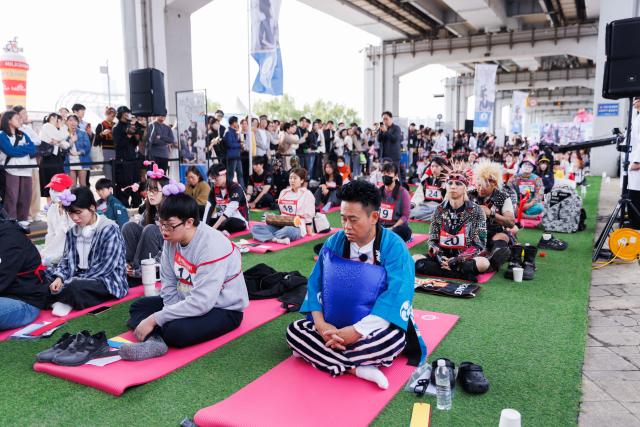 (250511) -- SEOUL, May 11, 2025 (Xinhua) -- Competitors participate in a space-out competition at Banpo Han River Park in Seoul, South Korea, May 11, 2025. The winner of the event would be decided based on the stability of participants' heart rate and the vote of the audience. (Photo by Park Jintaek/Xinhua)