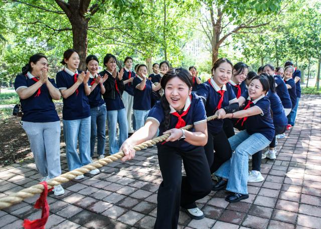 (250511) -- JIAOZUO, May 11, 2025 (Xinhua) -- Nurses from a local health center participate in a tug-of-war competition during a fun sports game in Qinghua Town of Bo'ai County, Jiaozuo, central China's Henan Province, May 9, 2025. International Nurses Day, which falls annually on May 12, have recently been observed across China in various forms. (Photo by Cheng Quan/Xinhua)