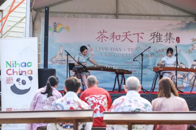 (250511) -- AUCKLAND, May 11, 2025 (Xinhua) -- People enjoy Chinese folk music during the "Tea for Harmony" cultural salon in Auckland, New Zealand, May 11, 2025. The cultural salon on tea was held on Sunday at the picturesque Howick Historical Village in New Zealand's largest city Auckland, inviting guests and local residents to immerse themselves in the richness of traditional Chinese culture while promoting dialogue and friendship between China and New Zealand. (Xinhua/Long Lei)