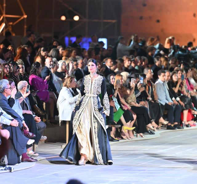 (250511) -- MARRAKECH, May 11, 2025 (Xinhua) -- A model presents a creation during a caftan fashion show in Marrakech, Morocco, May 10, 2025. The fashion show was held here from May 8 to May 11 to promote caftan, a traditional dress mostly worn by Moroccan women for special occasion. (Photo by Saouri Aissa/Xinhua)
