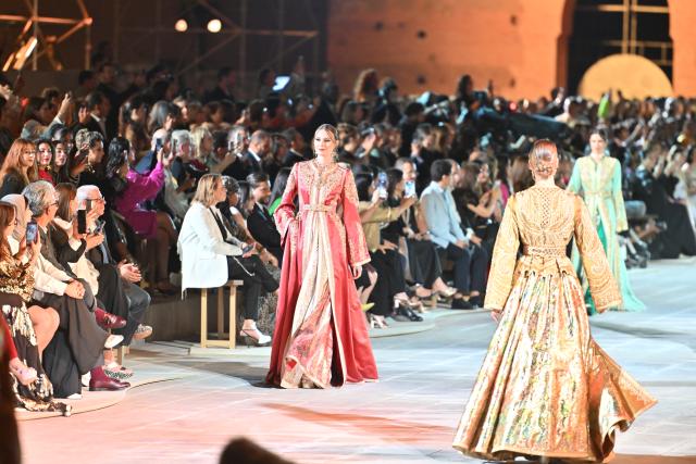 (250511) -- MARRAKECH, May 11, 2025 (Xinhua) -- Models present creations during a caftan fashion show in Marrakech, Morocco, May 10, 2025. The fashion show was held here from May 8 to May 11 to promote caftan, a traditional dress mostly worn by Moroccan women for special occasion. (Photo by Saouri Aissa/Xinhua)