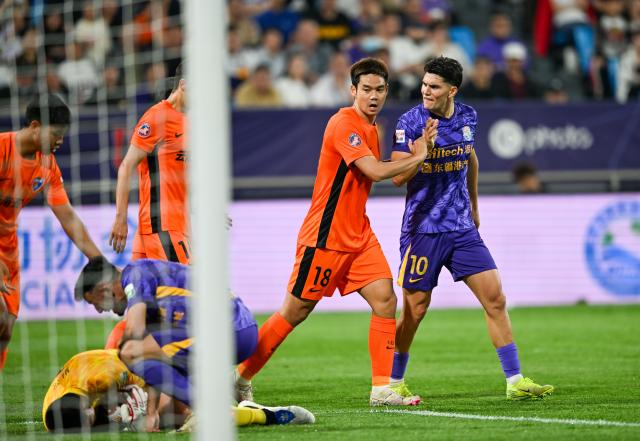 (250511) -- TIANJIN, May 11, 2025 (Xinhua) -- Cristian Salvador (R) of Tianjin Jinmen Tiger reacts during the 12nd round match between Tianjin Jinmen Tiger and Yunnan Yukun at the 2025 season Chinese Football Super League (CSL) in north China's Tianjin, May 11, 2025. (Xinhua/Sun Fanyue)