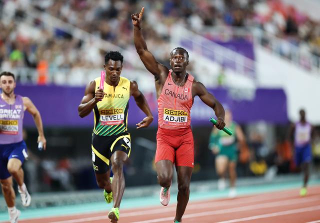 (250511) -- GUANGZHOU, May 11, 2025 (Xinhua) -- Eliezer Adjibi (R) of team Canada celebrates after the mixed 4x100m relay final at the World Athletics Relays Guangzhou 2025 in Guangzhou, south China's Guangdong Province, May 11, 2025. (Xinhua/Liu Dawei)
