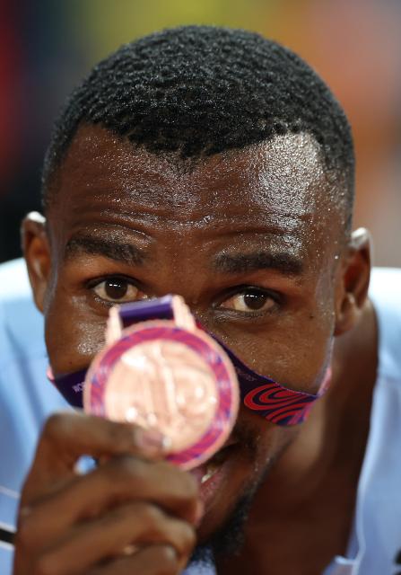 (250511) -- GUANGZHOU, May 11, 2025 (Xinhua) -- Leungo Scotch of team Botswana poses with the bronze medal after the men's 4x400m relay final at the World Athletics Relays Guangzhou 2025 in Guangzhou, south China's Guangdong Province, May 11, 2025. (Xinhua/Li Ming)
