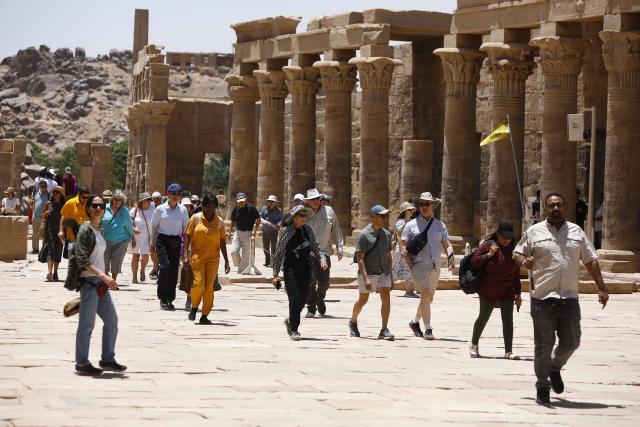 (250512) -- CAIRO, May 12, 2025 (Xinhua) -- Tourists visit the Philae Temple complex by the Nile River in Aswan, Egypt, May 3, 2025.
  TO GO WITH "Feature: Egypt's cultural south charms tourists worldwide" (Xinhua/Ahmed Gomaa)