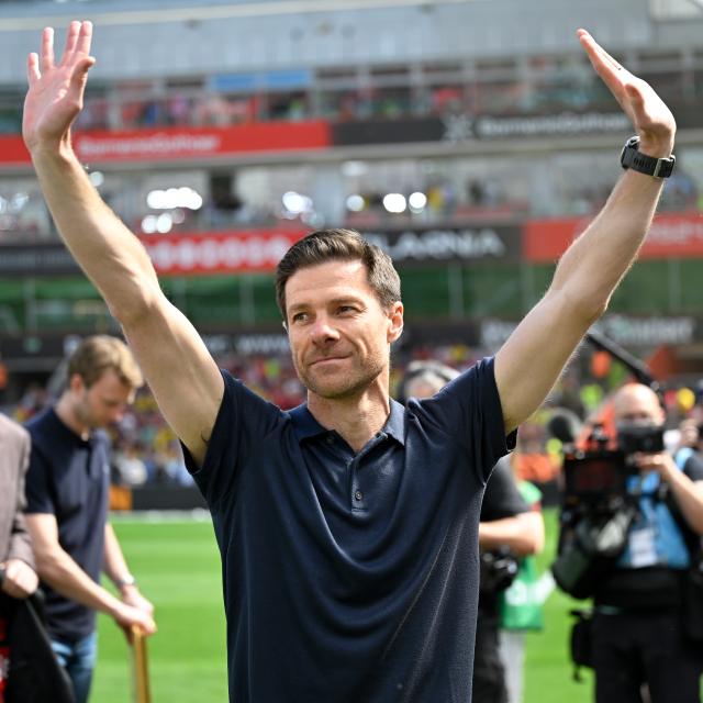(250512) -- LEVERKUSEN, May 12, 2025 (Xinhua) -- Xabi Alonso, head coach of Bayer 04 Leverkusen, waves to the spectators before the first division of Bundesliga football match between Bayer 04 Leverkusen and Borussia Dortmund in Leverkusen, Germany, May 11, 2025. (Photo by Ulrich Hufnagel/Xinhua)
