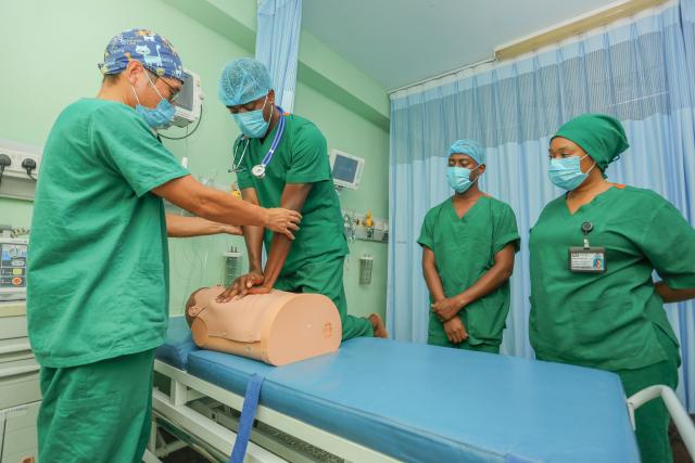 (250512) -- DAR ES SALAAM, May 12, 2025 (Xinhua) -- Zhang Junqiao (1st L), leader of the 27th Chinese medical team in Tanzania, instructs local Tanzanian nurses to learn first aid knowledge in Dar es Salaam, Tanzania, May 9, 2025.
  TO GO WITH "Feature: Chinese doctor empowers Tanzanian nurses with advanced medical skills and beyond" (Xinhua/Emmanuel Herman)