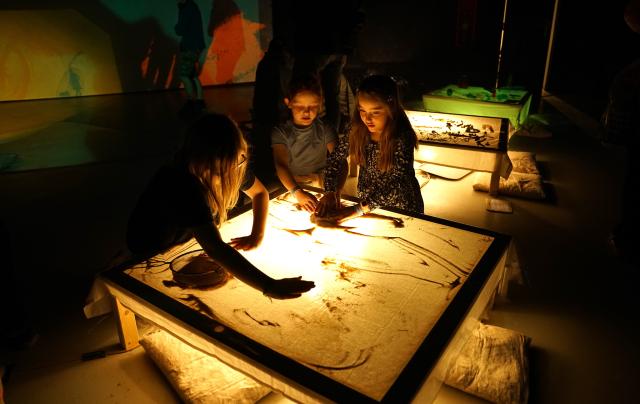 (250512) -- PRAGUE, May 12, 2025 (Xinhua) -- Girls create a sand picture during the Maker Faire Prague 2025 in Prague, the Czech Republic, May 11, 2025.
  The two-day creativity show highlights a combination of modern technology and traditional craftsmanship. (Photo by Dana Kesnerova/Xinhua)