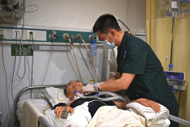 (250512) -- SHENYANG, May 12, 2025 (Xinhua) -- Shao Long tends a patient at the First Hospital of China Medical University in Shenyang, northeast China's Liaoning Province, May 8, 2025.
  Shao Long serves as the head nurse of the emergency department at the Shenyang-based First Hospital of China Medical University. With 17 years of experience in emergency nursing, Shao has participated in rescuing over 4,300 critically ill patients and currently leads a nursing team of more than 20 members.
  During the fight against COVID-19 in Wuhan, Shao contributed to the preparations of building the makeshift hospitals. He worked 58 consecutive days and nights to fulfill nursing responsibilities.
  In daily management, he keeps focusing on standardizing nursing procedures, conducting emergency rescue training, and organizing emergency response drills. To date, Shao has trained over 10 nursing instructors responsible for departmental training and education. 
  "Emergency workers safeguard patients with expertise and belief," he said. (Xinhua/Wu Qinghao)