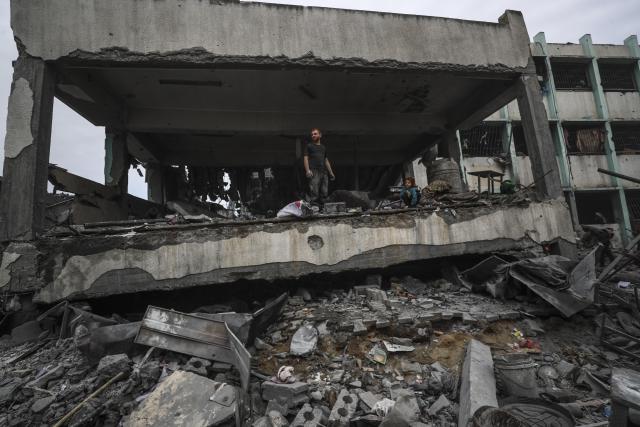 (250512) -- GAZA, May 12, 2025 (Xinhua) -- Palestinians inspect a damaged school after an Israeli airstrike in the Jabalia refugee camp, northern Gaza Strip, May 12, 2025. (Photo by Mahmoud Zaki/Xinhua)