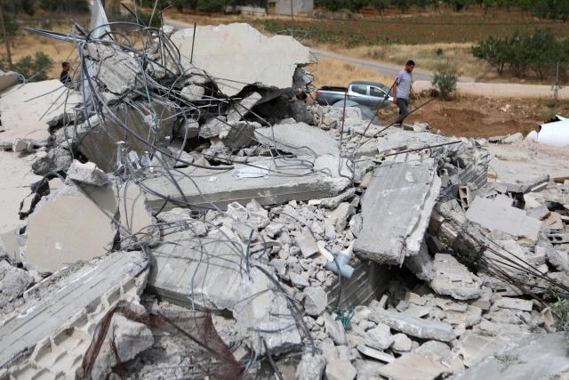 (250512) -- HEBRON, May 12, 2025 (Xinhua) -- A Palestinian is seen among rubble after Israeli excavators demolished a house in the village of Idna, west of the West Bank city of Hebron, May 12, 2025. (Photo by Mamoun Wazwaz/Xinhua)