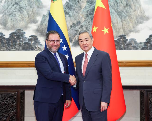 (250512) -- BEIJING, May 12, 2025 (Xinhua) -- Chinese Foreign Minister Wang Yi, also a member of the Political Bureau of the Communist Party of China Central Committee, meets with Venezuelan Foreign Minister Yvan Gil in Beijing, capital of China, May 12, 2025. (Xinhua/Liu Bin)