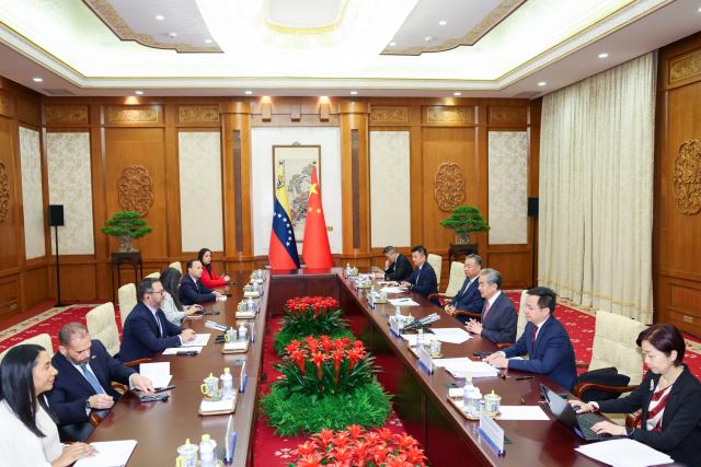 (250512) -- BEIJING, May 12, 2025 (Xinhua) -- Chinese Foreign Minister Wang Yi, also a member of the Political Bureau of the Communist Party of China Central Committee, meets with Venezuelan Foreign Minister Yvan Gil in Beijing, capital of China, May 12, 2025. (Xinhua/Liu Bin)