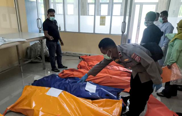 (250512) -- GARUT, May 12, 2025 (Xinhua) -- This photo taken with a mobile phone shows officers collecting data of victims of ammunition disposal blast at a hospital in Garut Regency, West Java Province, Indonesia, May 12, 2025. At least 13 people were killed when the Indonesian army destroyed expired ammunition in West Java province on Monday, a military officer said. (West Java Regional Police Station/Handout via Xinhua)