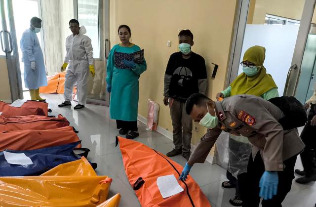 (250512) -- GARUT, May 12, 2025 (Xinhua) -- This photo taken with a mobile phone shows officers collecting data of victims of ammunition disposal blast at a hospital in Garut Regency, West Java Province, Indonesia, May 12, 2025. At least 13 people were killed when the Indonesian army destroyed expired ammunition in West Java province on Monday, a military officer said. (West Java Regional Police Station/Handout via Xinhua)