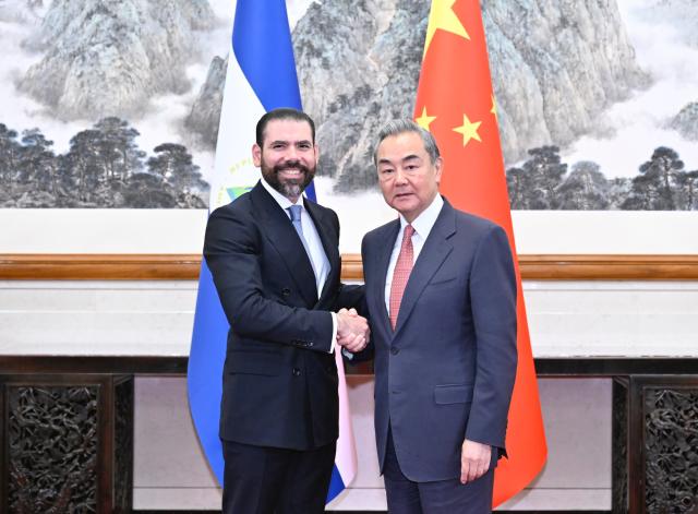 (250512) -- BEIJING, May 12, 2025 (Xinhua) -- Chinese Foreign Minister Wang Yi, also a member of the Political Bureau of the Communist Party of China Central Committee, shakes hands with Laureano Ortega Murillo, presidential adviser of Nicaragua, in Beijing, capital of China, May 12, 2025. Wang met with Laureano Ortega Murillo and Valdrack Ludwing Jaentschke Whitaker, minister for foreign affairs of Nicaragua, here on Monday. (Xinhua/Yue Yuewei)