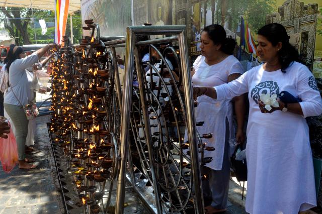 (250512) -- COLOMBO, May 12, 2025 (Xinhua) -- People participate in a celebration of Vesak Day in Colombo, Sri Lanka, on May 12, 2025. (Photo by Gayan Sameera/Xinhua)