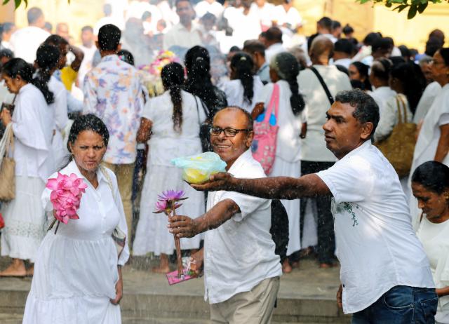 (250512) -- COLOMBO, May 12, 2025 (Xinhua) -- People participate in a celebration of Vesak Day in Colombo, Sri Lanka, on May 12, 2025. (Photo by Ajith Perera/Xinhua)
