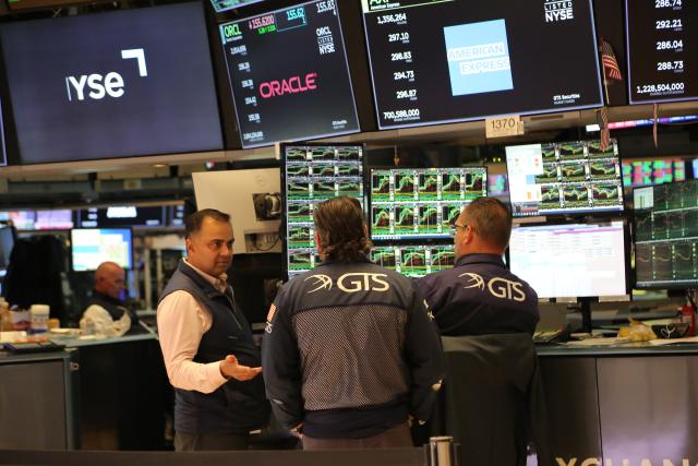 (250512) -- NEW YORK, May 12, 2025 (Xinhua) -- Traders work on the floor of the New York Stock Exchange in New York, the United States, on May 12, 2025. U.S. stocks rallied sharply on Monday after the United States and China announced a temporary rollback of reciprocal tariffs, providing much-needed relief to investors concerned about the escalating trade war's economic fallout. The Dow Jones Industrial Average rose 1,160.72 points, or 2.81 percent, to 42,410.1. The S&P 500 added 184.28 points, or 3.26 percent, to 5,844.19. The Nasdaq Composite Index increased 779.43 points, or 4.35 percent, to 18,708.34. (Xinhua/Liu Yanan)