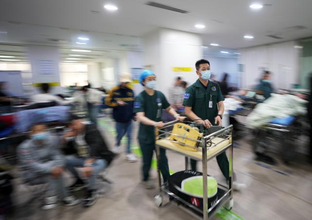 (250513) -- BEIJING, May 13, 2025 (Xinhua) -- Shao Long (R) heads for the rescue of a respiratory and cardiac arrest case at the First Hospital of China Medical University in Shenyang, northeast China's Liaoning Province, May 10, 2025.
  Shao serves as the head nurse of the emergency department of the hospital. With 17 years of experience in emergency nursing, Shao has participated in rescuing over 4,300 critically ill patients and currently leads a nursing team of more than 20 members. (Xinhua/Li Gang)