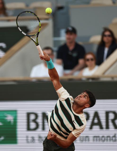 (250531) -- PARIS, May 31, 2025 (Xinhua) -- Carlos Alcaraz of Spain serves during the men's singles third round match against Damir Dzumhur of Bosnia and Herzegovina at the French Open tennis tournament at Roland Garros, Paris, France, May 30, 2025. (Xinhua/Li Jing)