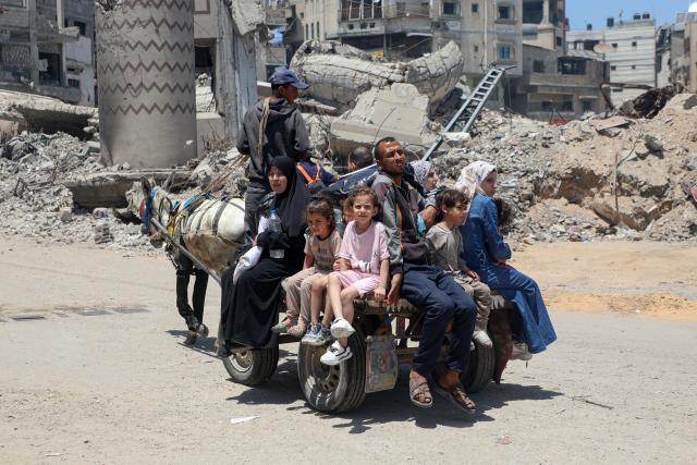 (250531) -- GAZA, May 31, 2025 (Xinhua) -- Displaced Palestinians are pictured on a street in Jabalia refugee camp, as they flee with their belongings from Jabalia area in northern Gaza Strip to central and western Gaza City, on May 30, 2025. (Photo by Rizek Abdeljawad/Xinhua)