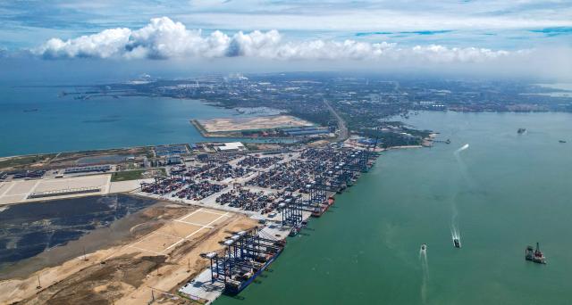 (250601) -- BEIJING, June 1, 2025 (Xinhua) -- This aerial drone photo taken on May 28, 2025 shows a view of the Yangpu International Container Port in the Yangpu Economic Development Zone in Danzhou, south China's Hainan Province.
  In June 2020, China released a master plan to build the whole of Hainan Island into a globally influential and high-level free trade port by the middle of the century.
  Series of opening-up policies have been issued to create a "foreign investor-friendly" business environment in Hainan. Local immigration authorities have implemented measures, such as the utilization of one-stop customs clearance service, to improve the customs clearance efficiency and to reduce the operational costs of enterprises.
  As a key initiative in China's opening-up strategy, the Hainan Free Trade Port is set to begin independent customs operations by year end, and global enterprises are eyeing the vast opportunities that come with open trade. (Xinhua/Yang Guanyu)