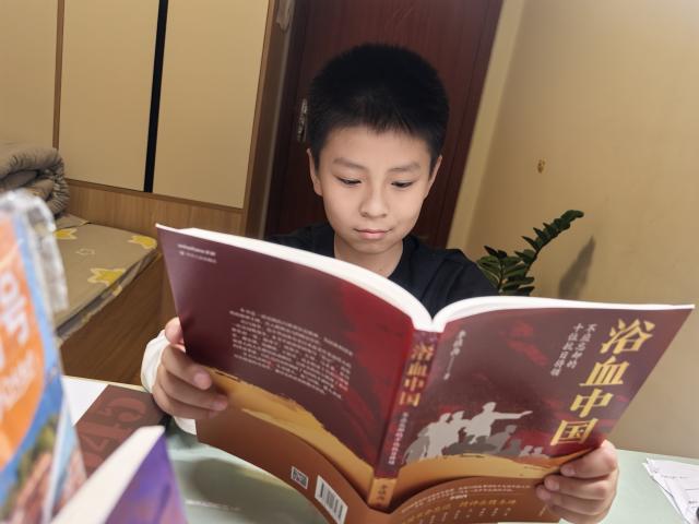 (250601) -- LANZHOU, June 1, 2025 (Xinhua) -- This undated photo provided by interviewee shows Zhang Shucheng, a 10-year-old student, reading a book at his home in Lanzhou, northwest China's Gansu Province. TO GO WITH "China Focus: 80 years on, WWII stories still captivate Chinese youth" (Xinhua)