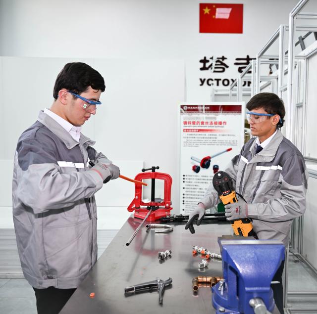 (250601) -- DUSHANBE, June 1, 2025 (Xinhua) -- Students learn skills at the Luban Workshop in Dushanbe, Tajikistan, May 31, 2025. The Luban Workshop in Tajikistan, co-founded by China's Tianjin Urban Construction Management and Vocation Technology College and Tajik Technical University, was officially put into operation in November 2022. It covers 1,138 square meters and is the first of its kind in Central Asia.
   The workshop, named after Lu Ban, an ancient Chinese woodcraft master, is a Chinese vocational workshop program training talent overseas, a win-win model for vocational education cooperation.
    So far, the workshop has provided learning and training opportunities for more than 1,500 undergraduate and graduate students. (Xinhua/Li Renzi)