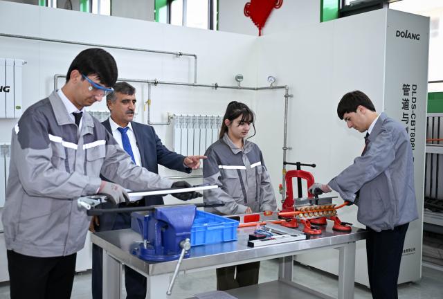(250601) -- DUSHANBE, June 1, 2025 (Xinhua) -- Students learn skills at the Luban Workshop in Dushanbe, Tajikistan, May 31, 2025. The Luban Workshop in Tajikistan, co-founded by China's Tianjin Urban Construction Management and Vocation Technology College and Tajik Technical University, was officially put into operation in November 2022. It covers 1,138 square meters and is the first of its kind in Central Asia.
   The workshop, named after Lu Ban, an ancient Chinese woodcraft master, is a Chinese vocational workshop program training talent overseas, a win-win model for vocational education cooperation.
    So far, the workshop has provided learning and training opportunities for more than 1,500 undergraduate and graduate students. (Xinhua/Li Renzi)