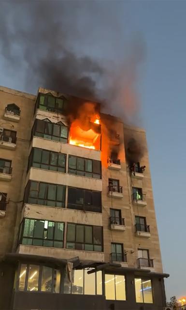 (250601) -- KUWAIT CITY, June 1, 2025 (Xinhua) -- A fire breaks out at a residential building in the Al-Riggae area in Farwaniya Governorate, Kuwait, June 1, 2025. Three people were killed and several others injured on Sunday in a fire that broke out in two apartments of a residential building in the Al-Riggae area southwest of Kuwait City, the Kuwait Fire Force said in a press statement. (Kuwait Fire Force/Handout via Xinhua)