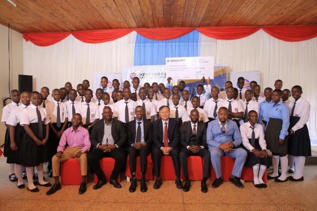 (250601) -- HOIMA, June 1, 2025 (Xinhua) -- Guests and scholarship awardees take a group photo during the 2025 Best Performers Awards ceremony in Hoima City, western Uganda, on June 30, 2025. China National Offshore Oil Corporation (CNOOC) has awarded scholarships to 300 top-performing students in western Uganda's oil region to further their education. TO GO WITH "Chinese firm offers scholarships to local students in W. Uganda" (CNOOC/Handout via Xinhua)