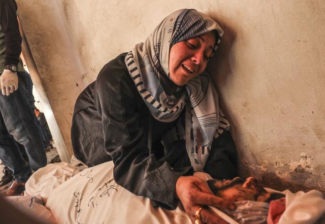 (250602) -- GAZA, June 2, 2025 (Xinhua) -- A Palestinian woman mourns a victim killed in an Israeli airstrike, at the Al-Ahli Arab Hospital in Gaza City, on June 2, 2025. The Israel Defense Forces (IDF) said in a statement on Monday that its troops had expanded ground operations in the Gaza Strip over the past day. In addition, the Israeli Air Force struck dozens of targets across the Gaza Strip since Sunday. (Photo by Mahmoud Zaki/Xinhua)