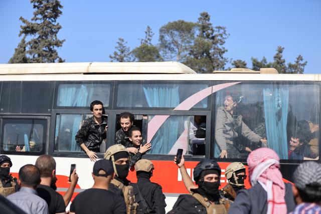 (250602) -- ALEPPO (SYRIA), June 2, 2025 (Xinhua) -- Released prisoners are seen on a bus after being released by the Syrian Democratic Forces (SDF) in Aleppo, northern Syria, on June 2, 2025. The Kurdish-led Syrian Democratic Forces (SDF) and Syrian interim authorities resumed a large-scale prisoner exchange in the northern city of Aleppo on Monday, signaling renewed efforts to ease tensions following weeks of disrupted coordination. (Str/Xinhua)