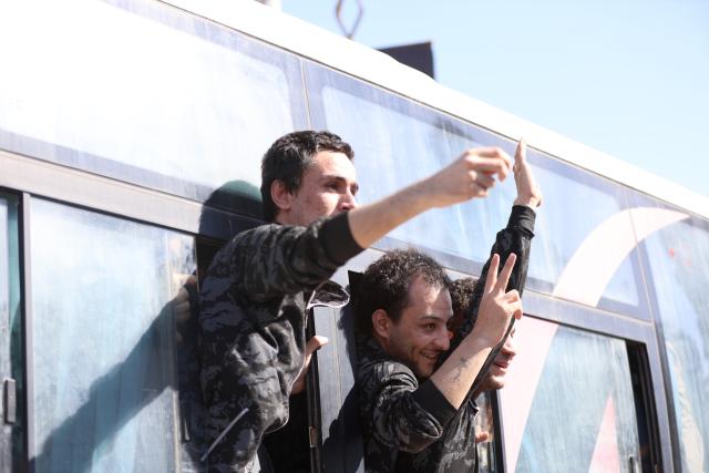 (250602) -- ALEPPO (SYRIA), June 2, 2025 (Xinhua) -- Released prisoners are seen on a bus after being released by the Syrian Democratic Forces (SDF) in Aleppo, northern Syria, on June 2, 2025. The Kurdish-led Syrian Democratic Forces (SDF) and Syrian interim authorities resumed a large-scale prisoner exchange in the northern city of Aleppo on Monday, signaling renewed efforts to ease tensions following weeks of disrupted coordination. (Str/Xinhua)