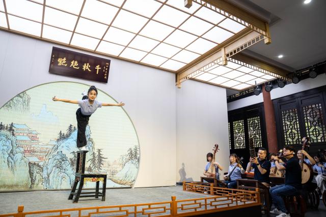 (250605) -- CHENZHOU, June 5, 2025 (Xinhua) -- Actress Xu Ying practices balancing skill at a small theater of the Hunan Kunqu Opera Troupe in Beihu District of Chenzhou City in central China's Hunan Province, June 4, 2025.
  The centuries-old Kunqu Opera has been listed by the United Nations Educational, Scientific and Cultural Organization (UNESCO) as an intangible cultural heritage. In recent years, the Hunan Kunqu Opera Troupe managed to cultivate a good number of outstanding young actors through professional training programs and community outreach campaigns, bringing this olden art into the attention and affection of a growing base of youngsters. (Xinhua/Chen Sihan)