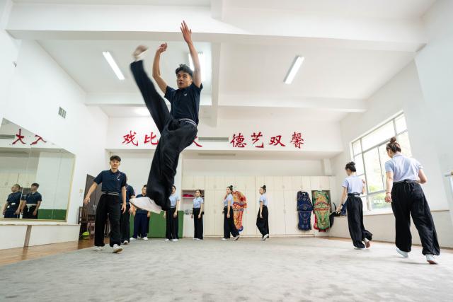 (250605) -- CHENZHOU, June 5, 2025 (Xinhua) -- Actor Liao Maoxin (front) takes basic training at the practice room of the Hunan Kunqu Opera Troupe in Beihu District of Chenzhou City in central China's Hunan Province, June 4, 2025.
  The centuries-old Kunqu Opera has been listed by the United Nations Educational, Scientific and Cultural Organization (UNESCO) as an intangible cultural heritage. In recent years, the Hunan Kunqu Opera Troupe managed to cultivate a good number of outstanding young actors through professional training programs and community outreach campaigns, bringing this olden art into the attention and affection of a growing base of youngsters. (Xinhua/Chen Sihan)