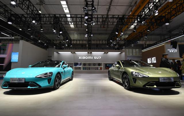 (250606) -- BEIJING, June 6, 2025 (Xinhua) -- This photo taken on Oct. 17, 2024 shows new energy vehicle model SU7 produced by Chinese tech firm Xiaomi displayed during the 2024 World Intelligent Connected Vehicles Conference in Beijing, capital of China. (Xinhua/Chen Zhonghao)