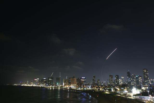 (250613) -- TEL AVIV, June 13, 2025 (Xinhua) -- Israeli air defense system fires to intercept missiles over Tel Aviv, Israel, on June 13, 2025. Dozens of missiles were fired from Iran into Israel on Friday evening, according to statements issued by the Israel Defense Forces (IDF). (Photo by Jamal Awad/Xinhua)