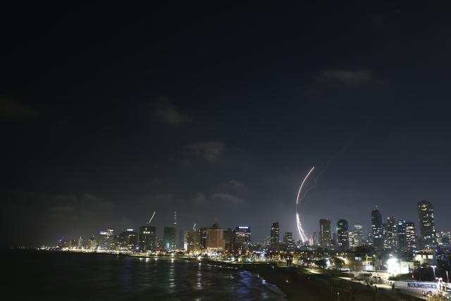 (250613) -- TEL AVIV, June 13, 2025 (Xinhua) -- Israeli air defense system fires to intercept missiles over Tel Aviv, Israel, on June 13, 2025. Dozens of missiles were fired from Iran into Israel on Friday evening, according to statements issued by the Israel Defense Forces (IDF). (Photo by Jamal Awad/Xinhua)