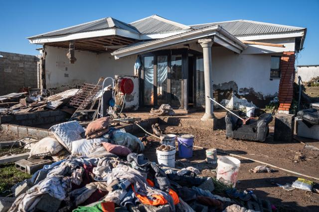 (250614) -- MTHATHA, June 14, 2025 (Xinhua) -- This photo taken on June 13, 2025 shows a flood-damaged house in Mthatha, Eastern Cape Province, South Africa. The death toll from the devastating floods in the Eastern Cape province of South Africa has risen to 78, with only 21 bodies identified so far, a senior government official confirmed on Thursday. (Photo by Johan Van Eeden/Xinhua)