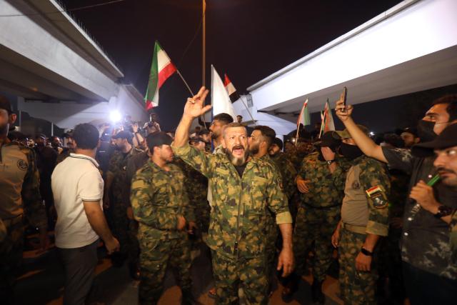 (250614) -- BAGHDAD, June 14, 2025 (Xinhua) -- Demonstrators hold a protest against Israeli attacks on Iran, in Baghdad, Iraq, on June 13, 2025. Earlier on Friday, Israel launched large-scale attacks on multiple targets in Iran, causing damage to Iran's nuclear facilities and casualties. (Xinhua/Khalil Dawood)