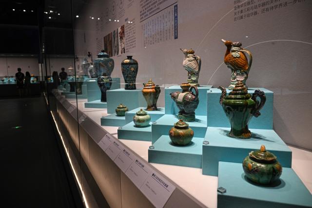 (250614) -- QIONGHAI, June 14, 2025 (Xinhua) -- This photo taken on June 13, 2025 shows porcelain exhibits at the China (Hainan) Museum of the South China Sea in Qionghai, south China's Hainan Province. A great number of exhibits relevant to the Maritime Silk Road are showcased at the China (Hainan) Museum of the South China Sea, providing valuable insights into the prosperity of the Maritime Silk Road in ancient China and the exchanges between Chinese and foreign civilizations. (Xinhua/Pu Xiaoxu)